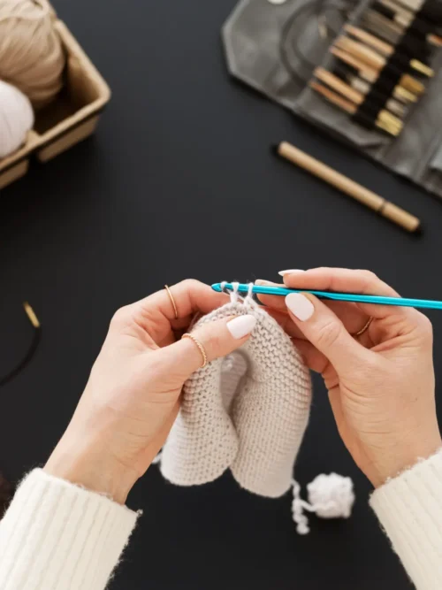 young-adult-organizing-their-crochet-products