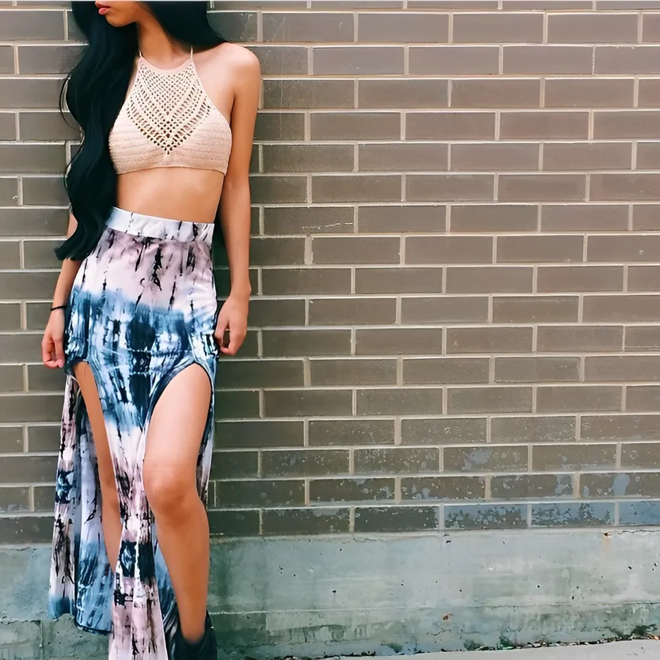 lady wearing crochet halter top and long skirt