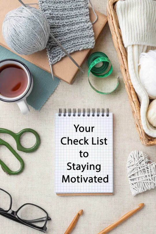 A note pad with crochet items saying your Check List to Staying Motivated - motivation