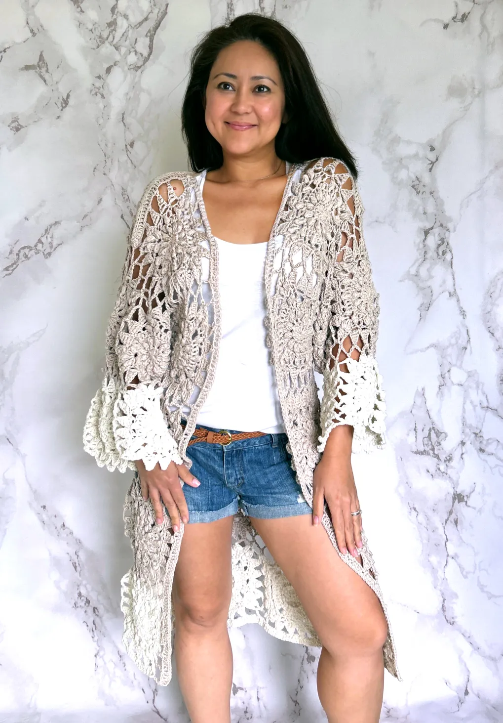 lady wearing a crochet kimono cardigan made with squares